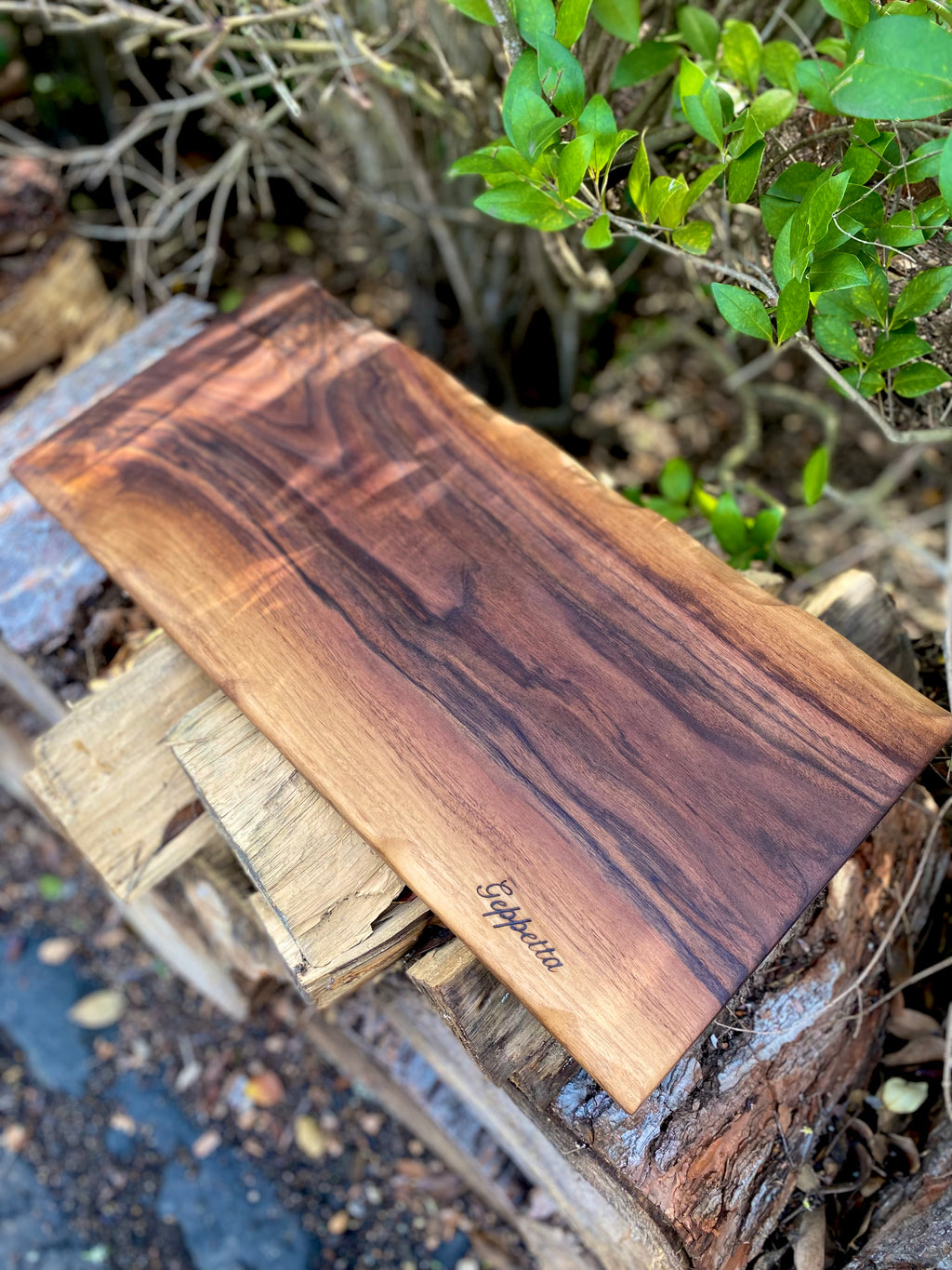 Custom, handmade charcuterie board with black walnut and food grade epoxy store